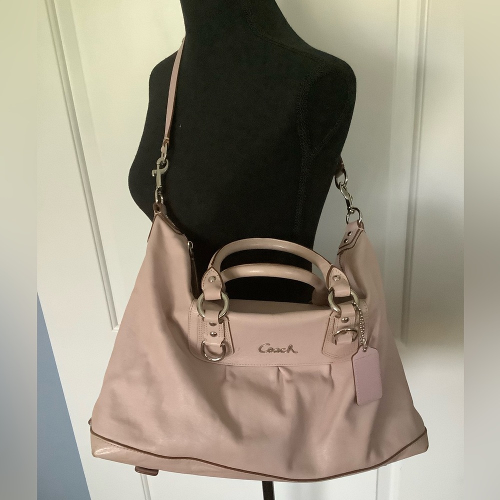 Pretty pink Coach bag with handles and removable strap